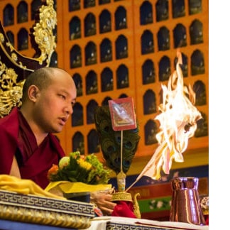 His Holiness Karmapa ritually burns away any obstacles for the deceased